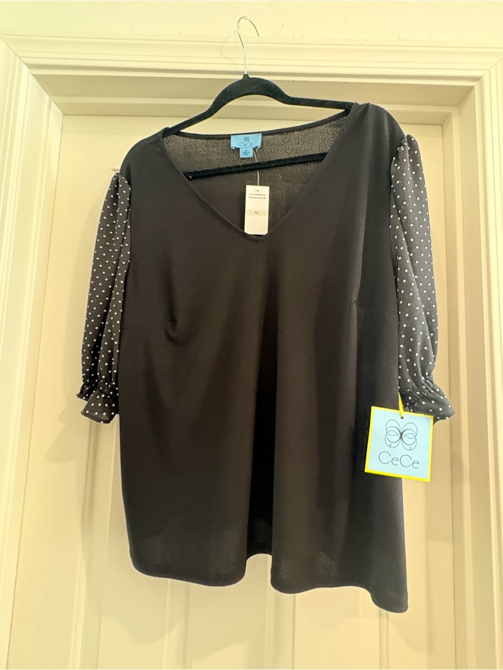 CeCe Black Top with Black-and-White Polka Dot Puff Sleeves